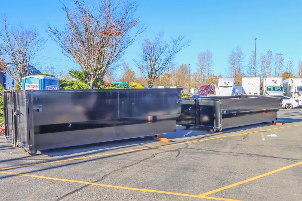 Professional dumpster rental service with roll-off container on residential driveway in Temple City